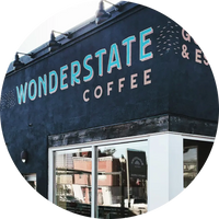 Wonderstate Coffee storefront with blue and white signage.