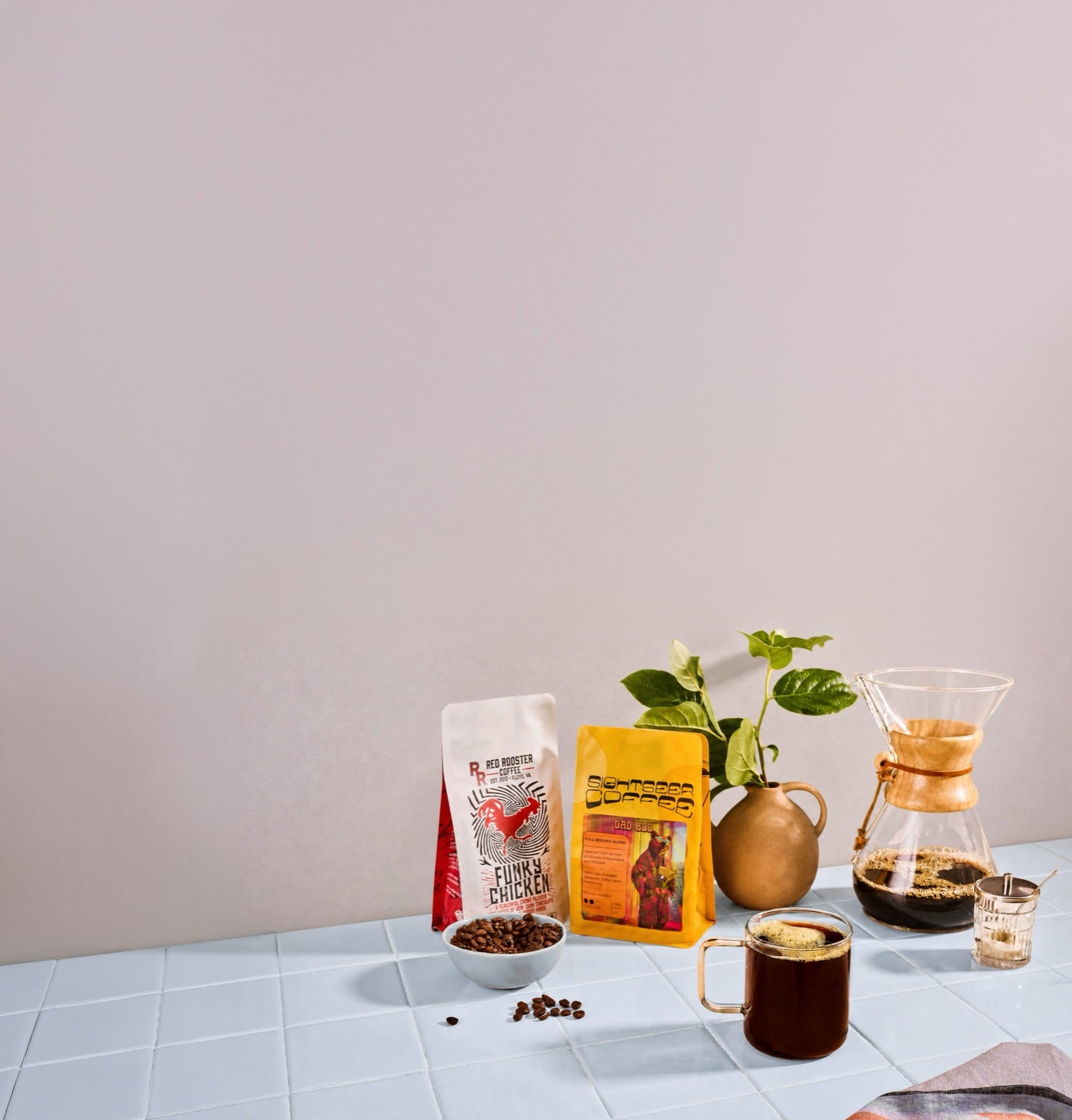 A Trade mug among bags from independent roasters